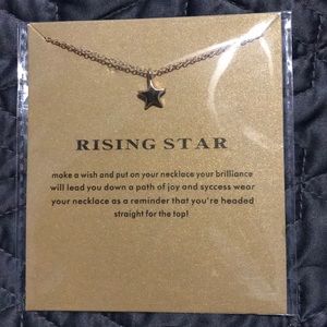 Gold tone dainty star necklace